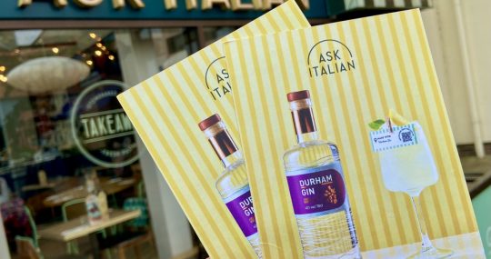 flyers promoting local gin-tasting event outside ask Italian in Durham